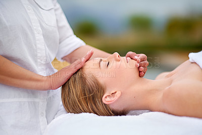 Buy stock photo Cropped shot of a young woman enjyoing a massage at the day spa
