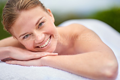 Buy stock photo Spa, happy woman and portrait on massage bed for wellness, beauty treatment or body care. Smile, relax and female person at luxury resort for stress relief, comfort or pamper on tropical holiday