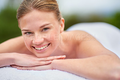 Buy stock photo Portrait, massage and happy woman on bed for spa treatment, wellness or body care. Smile, relax and face of female person at luxury resort for stress relief, comfort or pamper on tropical holiday