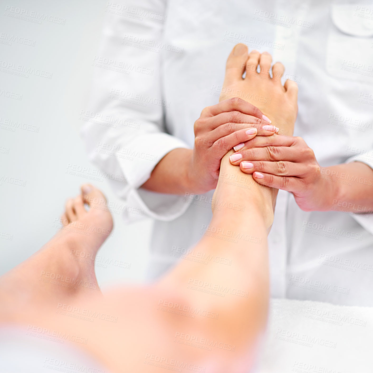Buy stock photo Client, woman and foot for massage at spa from therapist for  treatment or pedicure with hands for health or skincare. Professional, therapy and zen with body care or healing for wellness at resort

