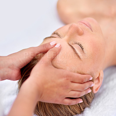 Buy stock photo Cropped shot of a young woman enjyoing a massage at the day spa
