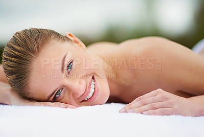 Buy stock photo Smile, spa and portrait of woman on massage bed for wellness, beauty treatment or body care. Happy, relax and female person at luxury resort for stress relief, comfort or pamper on tropical holiday
