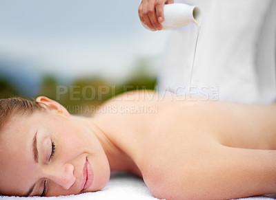 Buy stock photo Woman, oil and massage table in spa, therapy and self care for body wellness and resting for tension. Comfortable and resort with client, stress free and healing, calm session and cosmetology