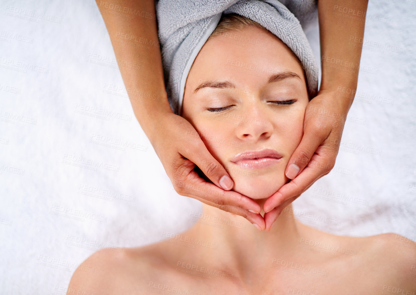 Buy stock photo Woman, hands and facial massage or pamper treatment, cosmetics and beauty therapy. Female person, masseuse and serene or dermatology, skin care detox and above at spa for peace or zen and healing