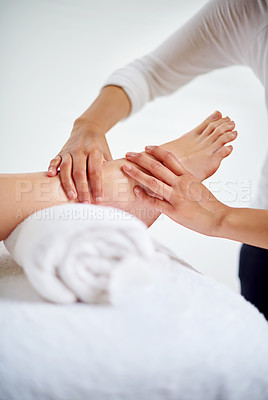 Buy stock photo Foot, hands and masseuse with massage at spa for treatment, beauty and skincare at luxury resort with wellness. Pedicure, cosmetics and people for physical therapy, healing for self care and relief