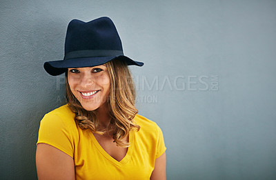 Buy stock photo Woman, smile and portrait by gray background with hat, fashion inspiration and mockup for marketing. Happy, confidence and face of gen z person by dark wall with advertising space, fedora and style
