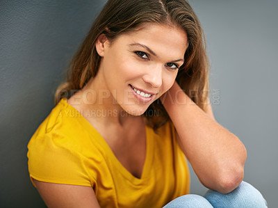Buy stock photo Wall, smile and woman on floor, portrait and relax for weekend, Gen z and streetwear for fashion in house. Grey background, happiness and girl in apartment, cheerful and comfortable on ground of home