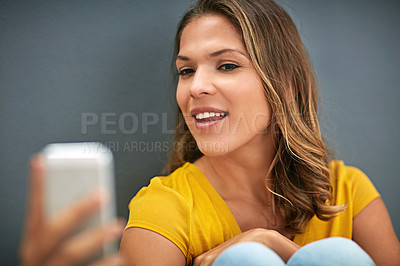 Buy stock photo Woman, confidence and smile with selfie in studio for social media update, memory and online blog. Influencer, network and happy in photography for content creation, post and pride on grey background