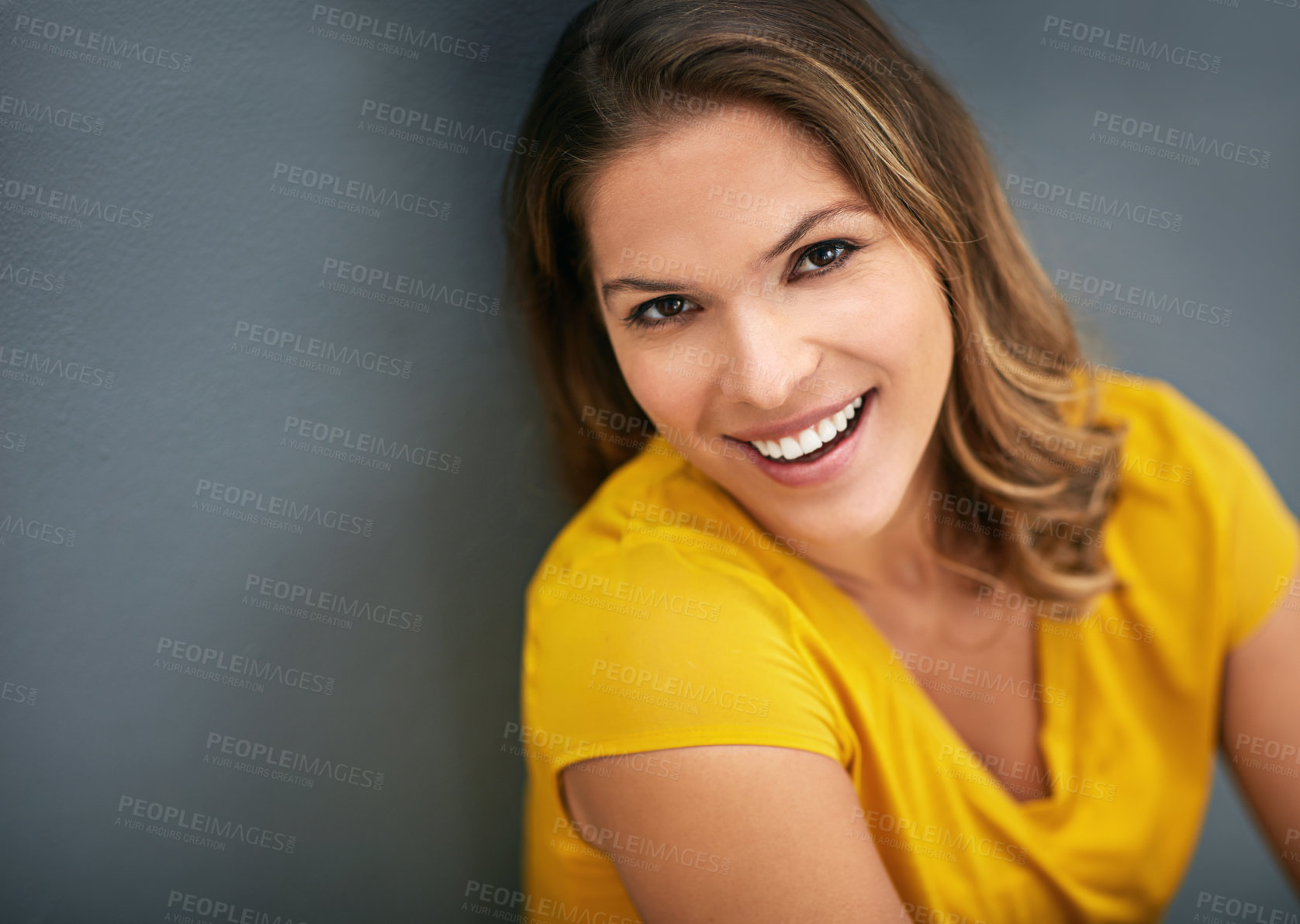 Buy stock photo Wall, morning and portrait of woman, rest and relax for with smile, Gen z and streetwear for fashion in house. Grey background, happiness and girl in apartment, cheerful and comfortable in home