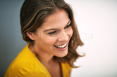 Buy stock photo Happy woman, smile and thinking on studio backdrop for relax, memory and optimistic on mockup. Female person, remember and nostalgia by grey background for daydream, ideas and laughing at joke
