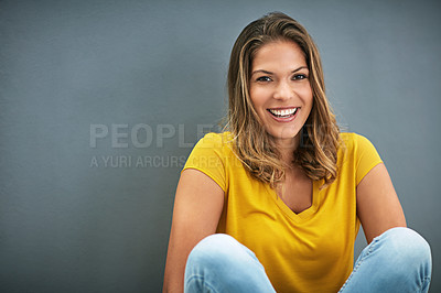 Buy stock photo Studio, beauty and portrait of woman, floor and lipstick of cosmetics, smile and pride on wall. Grey background, makeup and girl with joy for face, confidence and cheerful for break, weekend and USA