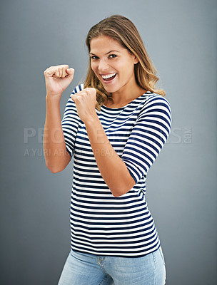 Buy stock photo Portrait of a young woman holding up her fists playfully