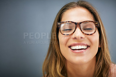 Buy stock photo Studio shot, girl and smile with glasses, close up and background. Laugh, optometry and smiling at camera with  isolated, cheerful and head shot for good mood, spectacles and excited with eyes closed