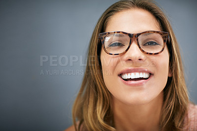 Buy stock photo Studio, girl and smile with glasses, close up and grey background. Laugh, optometry and smiling at camera with  isolated, cheerful and head shot for good mood, spectacles and excited with eyewear
