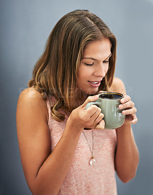 Buy stock photo Smile, coffee and woman in studio for happiness, break and calm morning on gray background. Mug, cappuccino and female person drinking hot beverage for relax, peace or to start day on dark backdrop