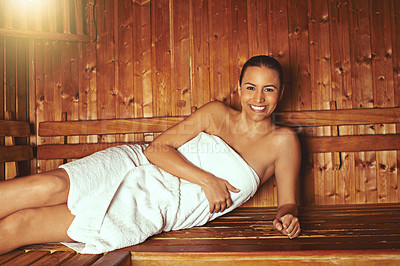 Buy stock photo Cropped portrait of a young woman relaxing in the sauna at a spa