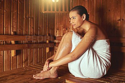 Buy stock photo Full length shot of a young woman relaxing in the sauna at a spa