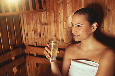 Buy stock photo Cropped shot of a young woman relaxing in the sauna at a spa