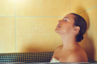 Buy stock photo Cropped shot of a young woman relaxing in a bathtub at a spa