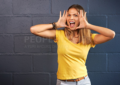 Buy stock photo Cropped portrait of a young woman shouting against a brick wall background