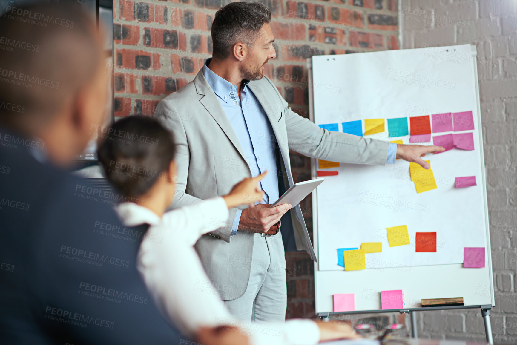 Buy stock photo Cropped shot of a businessman giving a presentation in the boardroom