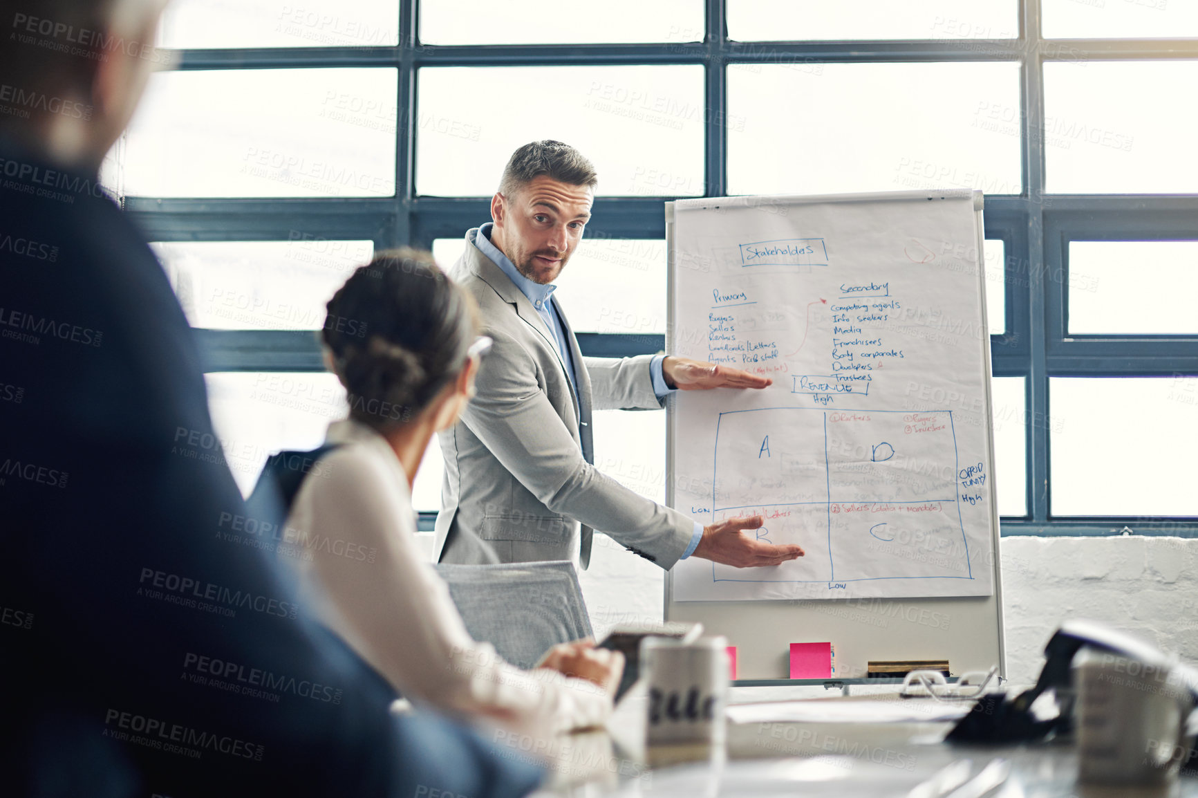 Buy stock photo Cropped shot of a businessman giving a presentation in the boardroom