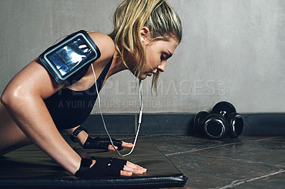 Buy stock photo Shot of a young woman doing push ups