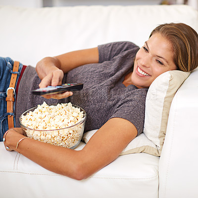 Buy stock photo Woman, sofa and food with remote and relax in home, popcorn and watching on weekend. Holiday, entertainment and break with movie or show, streaming or living room on couch for vacation and self care