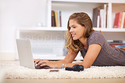 Buy stock photo Laptop, student and woman on floor for online learning, education and studying in home living room. Typing, lecture class for university on carpet, female person or relax for course work on website
