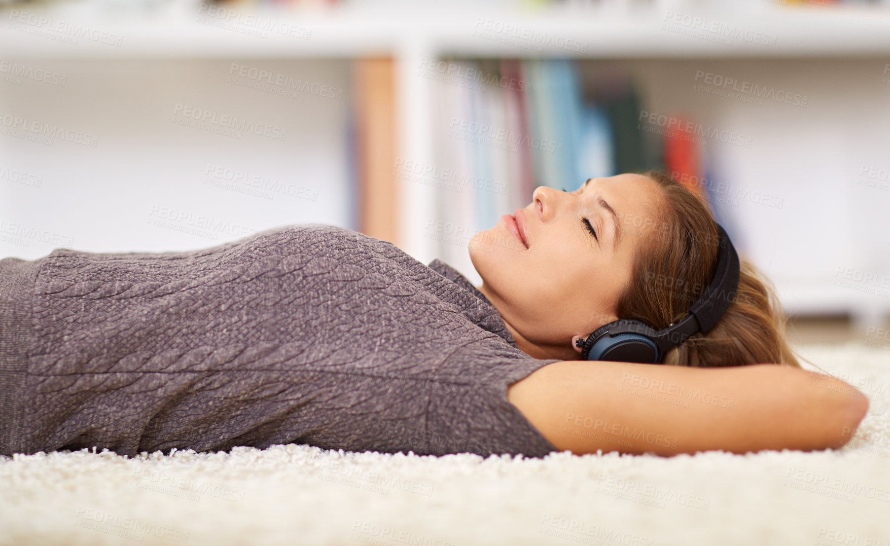 Buy stock photo Relax, headphones or girl sleeping with music streaming, subscription or podcast in home or house. Comfort, eyes closed or woman listening to audio, track or song to rest on carpet or floor for peace