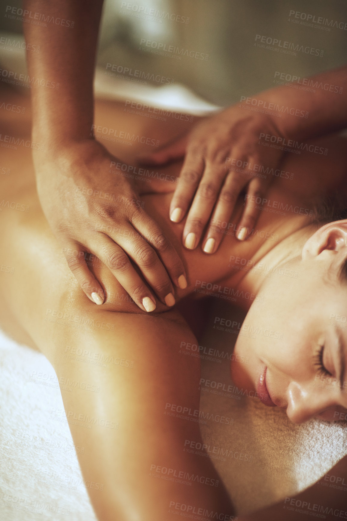 Buy stock photo Shot of a young woman enjoying a back massage