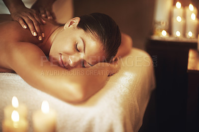 Buy stock photo Shot of a young woman enjoying a back massage