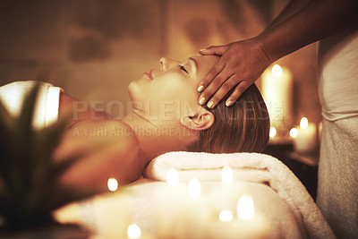 Buy stock photo Closeup shot of a young woman enjoying a head massage at the spa
