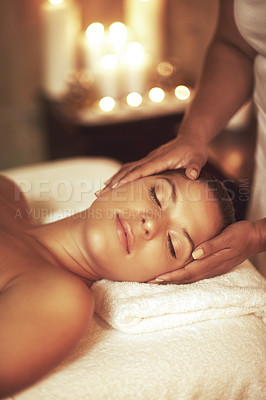Buy stock photo Closeup shot of a young woman enjoying a head massage at the spa