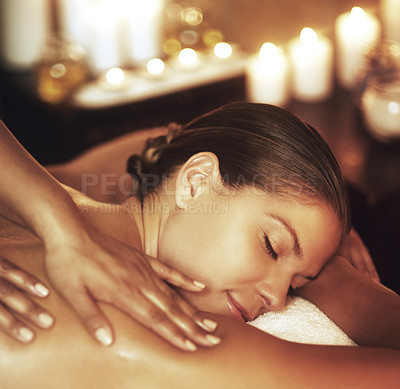 Buy stock photo Woman, spa and massage with sleep for wellness in Mauritius, relax with pamper for muscle or body. Female person, beauty or healing in salon with candles for peace, happiness or skin care on vacation