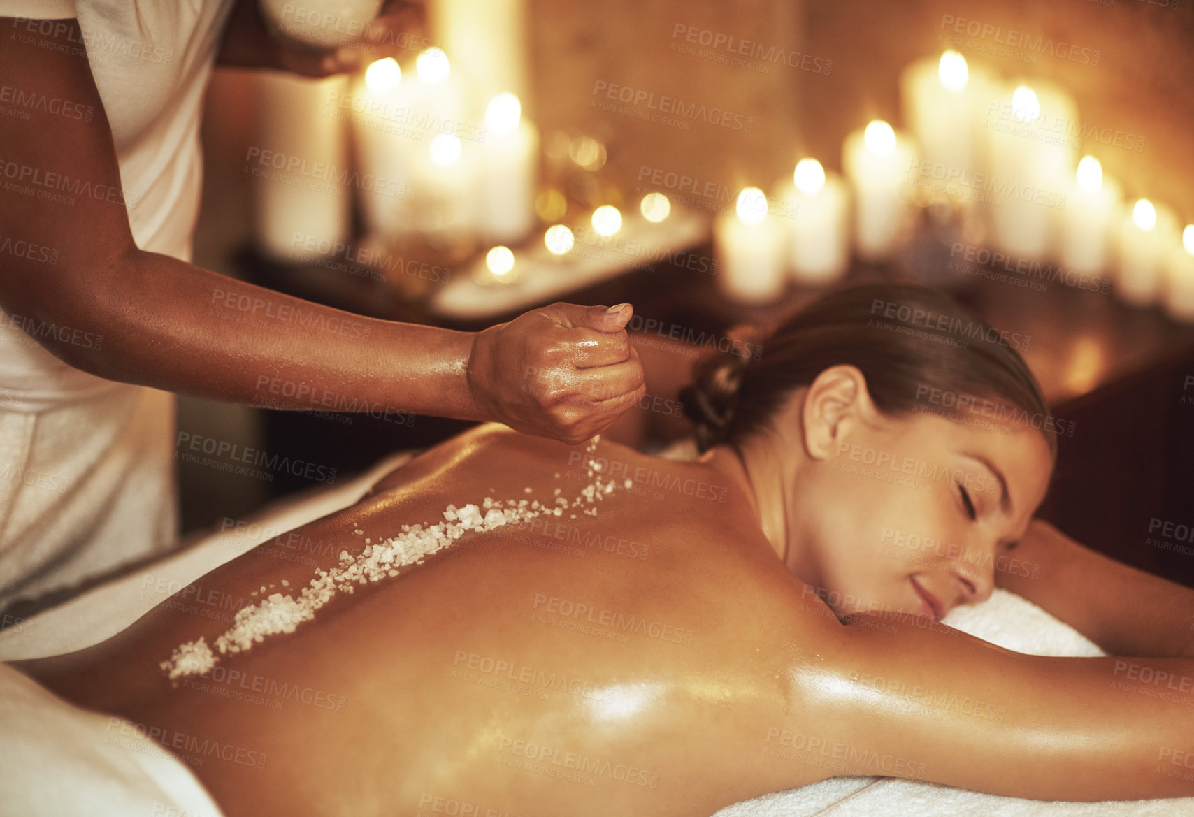 Buy stock photo Cropped shot of a young woman getting an exfoliating treatment at the spa