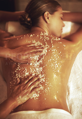 Buy stock photo Cropped shot of a young woman getting an exfoliating treatment at the spa