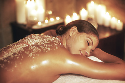 Buy stock photo Cropped shot of a young woman getting an exfoliating treatment at the spa
