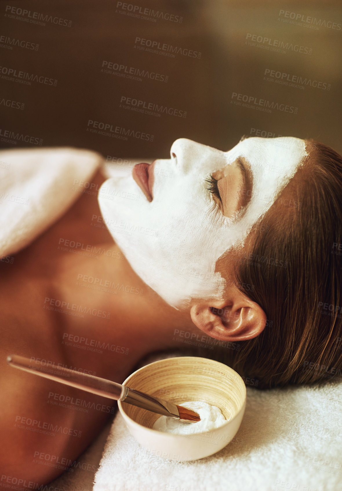 Buy stock photo Spa, face mask and woman with beauty brush, candles and skincare treatment at luxury hotel. Cosmetics, sleeping and calm client with anti aging and skin care with cream and facial lotion for wellness