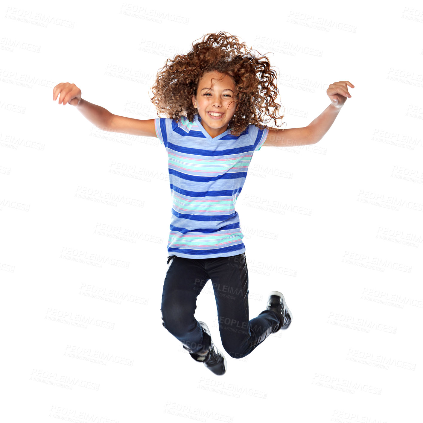 Buy stock photo Studio shot of a young girl jumping for joy against a white background