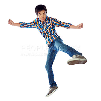 Buy stock photo Studio shot of a young boy jumping energetically against a white background