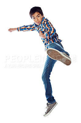 Buy stock photo Studio shot of a young boy jumping energetically against a white background