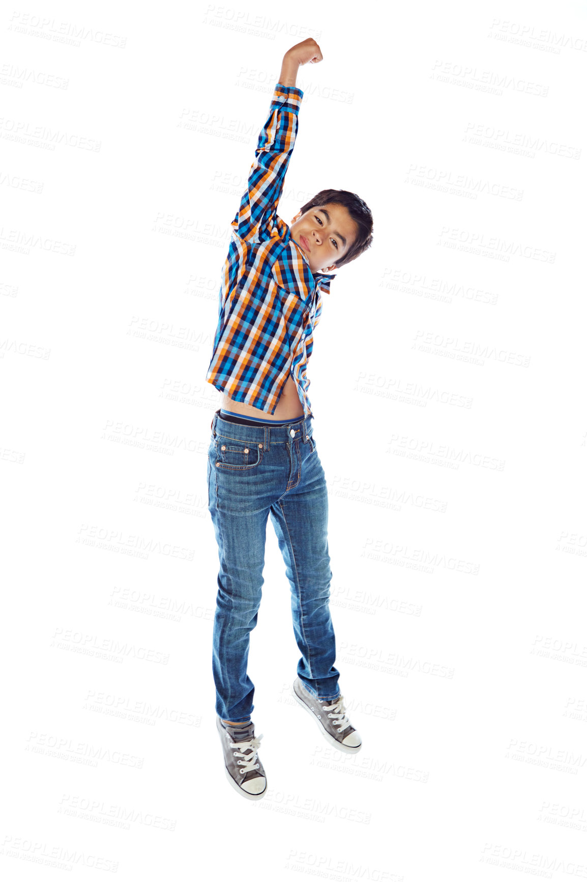 Buy stock photo Studio shot of a young boy jumping for joy against a white background