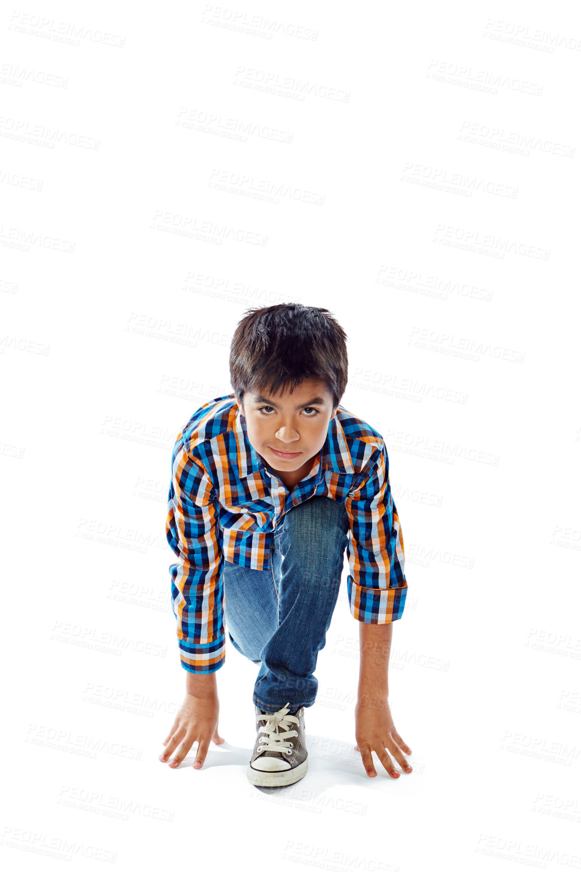 Buy stock photo Studio portrait of a young boy in a starting position against a white background