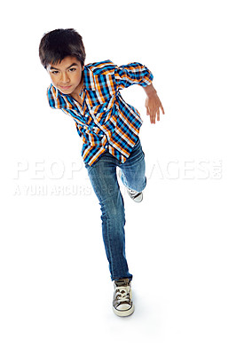 Buy stock photo Studio shot of a young boy running against a white background