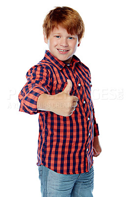 Buy stock photo Studio shot of a young boy giving a thumbs up against a white background