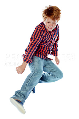 Buy stock photo Studio shot of a young boy jumping energetically against a white background