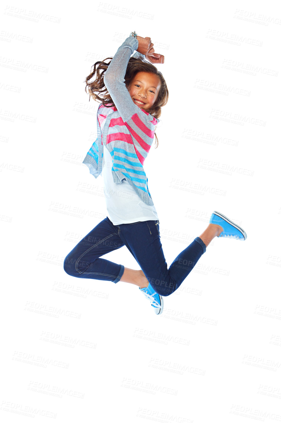 Buy stock photo Studio shot of a young girl jumping for joy against a white background