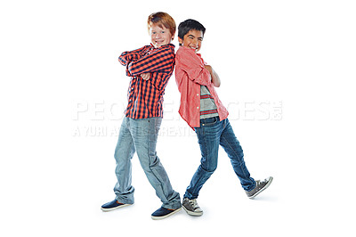 Buy stock photo Studio portrait of two best friends standing back to back against a white background