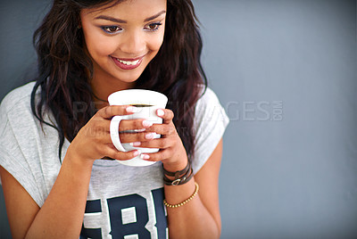 Buy stock photo Happy girl, drinking and coffee with cup for morning, caffeine or beverage on a gray studio background. Female person, brunette or model with smile for latte, cappuccino or espresso on mockup space